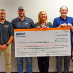 Photo of NIPSCO Check Presentation - Andrew Regnier, business agent with Heat & Frost Insulators Local 75, Yancy Gradeless, Valley Insulating Co. Inc., Rick Rittenhouse, MPHPL maintenance manager, MPHPL operations manager Dena Wargo, and Kirby Dipert, Michele Abrell and Voskra Darnell all representing NIPSCO