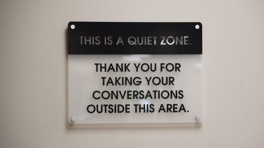 THIS IS A QUIET ZONE. THANK YOU FOR TAKING YOUR CONVERSATIONS OUTSIDE THIS AREA.