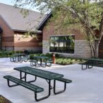 The Harris Branch Youth Courtyard, which borders the Harris Branch Youth Services area, features benches, picnic tables and a freshly manicured landscape.