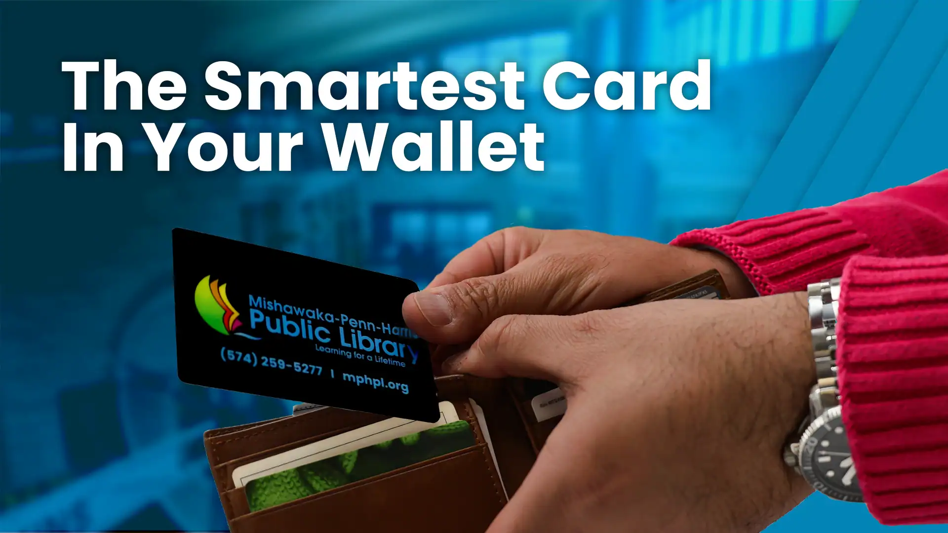 A person in a red sweater pulls a free library card from Mishawaka-Penn-Harris Public Library out of a wallet, with the text The Smartest Card In Your Wallet over a blue background.